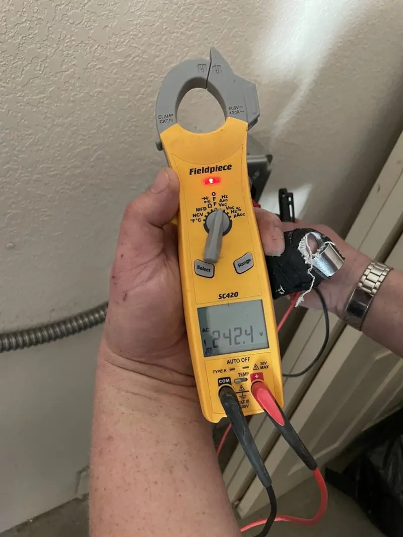 Voltage testing with clamp meter during Outlet Installation in Opa-locka
